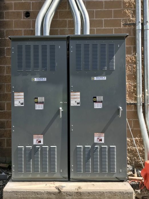 Outdoor electrical distribution enclosure with arc flash warning labels